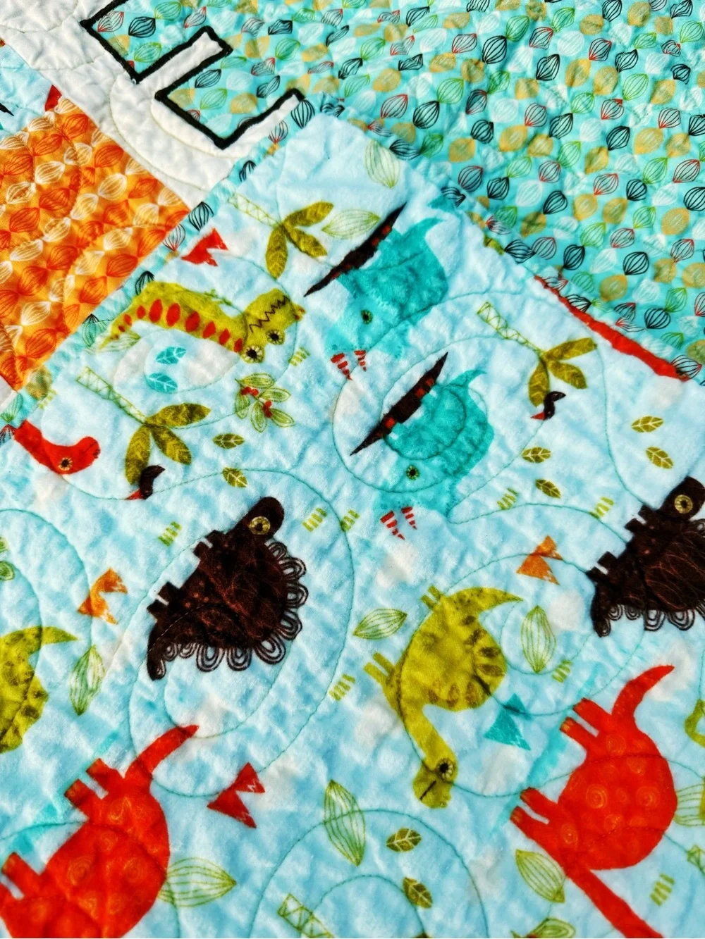 Playful Dino Patchwork Handmade Baby Quilt - Aqua & Orange